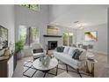 Living room with fireplace, light walls, and wood-look floors at 12411 Titus Ct # 12411, Tampa, FL 33612