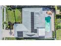 Bird's eye view showcasing home, pool, and solar panels at 5610 Dolores Dr, Holiday, FL 34690