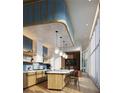 Modern community kitchen with wood cabinets and island seating at 3015 S Ysabella Ave # 803, Tampa, FL 33629
