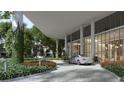 Luxury building entrance with porte cochere and landscaping at 3015 S Ysabella Ave # 2103, Tampa, FL 33629
