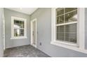 Light gray entryway with tile flooring and neutral tones at 12706 Palatka Dr, Venice, FL 34293