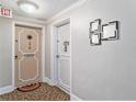 Building hallway with apartment doors and decorative accents at 4141 Bayshore Blvd # 1203, Tampa, FL 33611