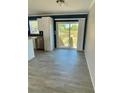 Bright dining area with sliding glass doors leading to backyard at 8353 Normandy Dr, Weeki Wachee, FL 34613