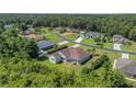 Aerial view of house and surrounding neighborhood at 6218 Bridleford Dr, Wesley Chapel, FL 33545