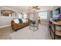 Bright living room with tiled floors and comfy furnishings at 3531 Umber Rd, Holiday, FL 34691