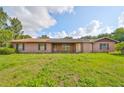 Single story home with a brick exterior and a well-maintained lawn at 12922 672 Hwy, Riverview, FL 33579