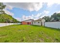 Spacious backyard with a shed and a tall fence for added privacy at 12922 672 Hwy, Riverview, FL 33579
