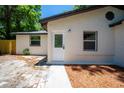 Newly renovated home exterior with a white facade at 8425 N Mulberry St, Tampa, FL 33604