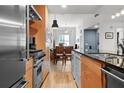 Open concept kitchen with stainless steel appliances and granite island at 1120 E Kennedy Blvd # 827, Tampa, FL 33602