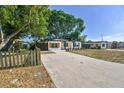 Updated home with a large driveway and mature trees at 5061 Jasmine Cir, St Petersburg, FL 33714