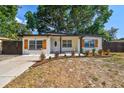 Newly renovated home with modern shutters and landscaping at 5061 Jasmine Cir, St Petersburg, FL 33714
