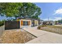Updated home with a large driveway and mature trees at 5061 Jasmine Cir, St Petersburg, FL 33714