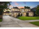 Two-story home with a brick facade and large driveway at 803 Bayshore Blvd, Tampa, FL 33606