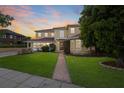 Stunning two-story home with a manicured lawn and walkway at 803 Bayshore Blvd, Tampa, FL 33606