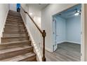Modern staircase leading to upper floor and home office at 9589 Cavendish Dr, Tampa, FL 33626