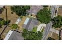 Aerial view of house showing the backyard, shed and surrounding houses at 1702 Blind Pond Ave, Lutz, FL 33549