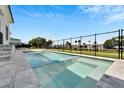 Inviting swimming pool with spa and fenced backyard at 6540 Simone Shores Cir, Apollo Beach, FL 33572