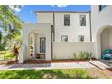 Stunning home featuring a stucco facade, arched entryway, and lush landscaping, creating a welcoming curb appeal at 4606 W Fig St # 4, Tampa, FL 33609