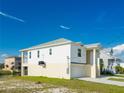 Newly built home with a two-car garage and elevated design at 3431 Sheephead Dr, Hernando Beach, FL 34607