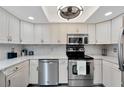 Modern kitchen featuring white cabinets and stainless steel appliances at 1028 Apollo Beach Blvd # 27, Apollo Beach, FL 33572