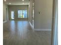 Spacious living room with tile flooring and large windows at 36188 Welsh Glade Rd, Dade City, FL 33525