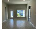Bright living room featuring tile floors and access to backyard at 36188 Welsh Glade Rd, Dade City, FL 33525