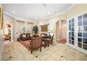 Elegant living room featuring a comfortable seating area and tile flooring at 1227 Toscano Dr, Trinity, FL 34655