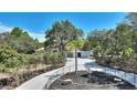 House with curved walkway and fountain in front at 13231 Snowy Plover Ave, Weeki Wachee, FL 34614