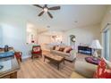 Open living room with hardwood floors and access to the kitchen at 2346 Nantucket Dr # 58, Sun City Center, FL 33573