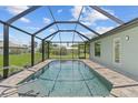 Screened-in pool with a modern design and ample deck space at 9171 Prospect Ave, Englewood, FL 34224