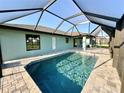 Screened-in pool and patio area with a modern design at 9171 Prospect Ave, Englewood, FL 34224