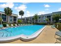 Inviting community pool area with lounge chairs and a relaxing atmosphere at 8693 Bardmoor Blvd # 308B, Seminole, FL 33777