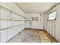 Empty storage room with metal shelving at 5353 Comanche St, Zephyrhills, FL 33542