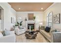 Inviting living room featuring a fireplace, mantel, neutral decor, recessed lighting, and plenty of natural light at 4108 W San Luis St, Tampa, FL 33629