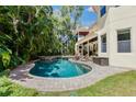 Inviting kidney-shaped pool with brick decking at 4108 W San Luis St, Tampa, FL 33629