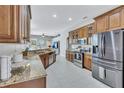 Modern kitchen with granite countertops and stainless steel appliances at 805 Woodcarver Ln, Brandon, FL 33510