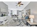 Spacious living room with large windows and comfortable seating at 805 Woodcarver Ln, Brandon, FL 33510