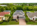 Two-story house situated on a large lot with mature trees at 21631 Cormorant Cove Dr, Land O Lakes, FL 34637