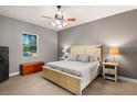 Main bedroom with ceiling fan and large windows at 32124 Corbin Ridge St, San Antonio, FL 33576