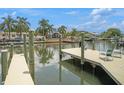 Expansive dock with seating and beautiful views of the canal at 8461 Flagstone Dr, Tampa, FL 33615