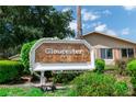 Gloucester community sign with tropical design and festive decor at 2220 Grenadier Dr # 2220, Sun City Center, FL 33573