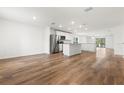 Open kitchen with stainless steel appliances and island at 5093 Burnside St, North Port, FL 34291