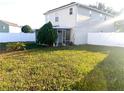 Backyard with screened patio and grassy area at 3316 Thistledown Ln, Land O Lakes, FL 34638