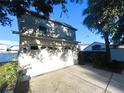 Two-car garage with driveway and landscaping at 3316 Thistledown Ln, Land O Lakes, FL 34638