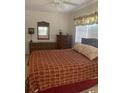 Bedroom with double bed and wicker furniture at 90 144Th Ave # 7, Madeira Beach, FL 33708