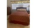 Bedroom with a double bed and wicker furniture at 90 144Th Ave # 7, Madeira Beach, FL 33708