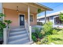 Charming home with a welcoming front porch, well-manicured landscaping, and a classic design at 1207 E 17Th Ave, Tampa, FL 33605