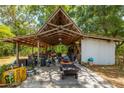 Large covered workshop with various equipment and tools at 16637 Livingston Ave, Lutz, FL 33559