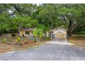 Cute yellow house with carport and fenced yard at 16637 Livingston Ave, Lutz, FL 33559