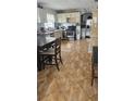Kitchen with wood cabinets, tile floors, and ample counter space at 2905 W Osborne Ave, Tampa, FL 33614